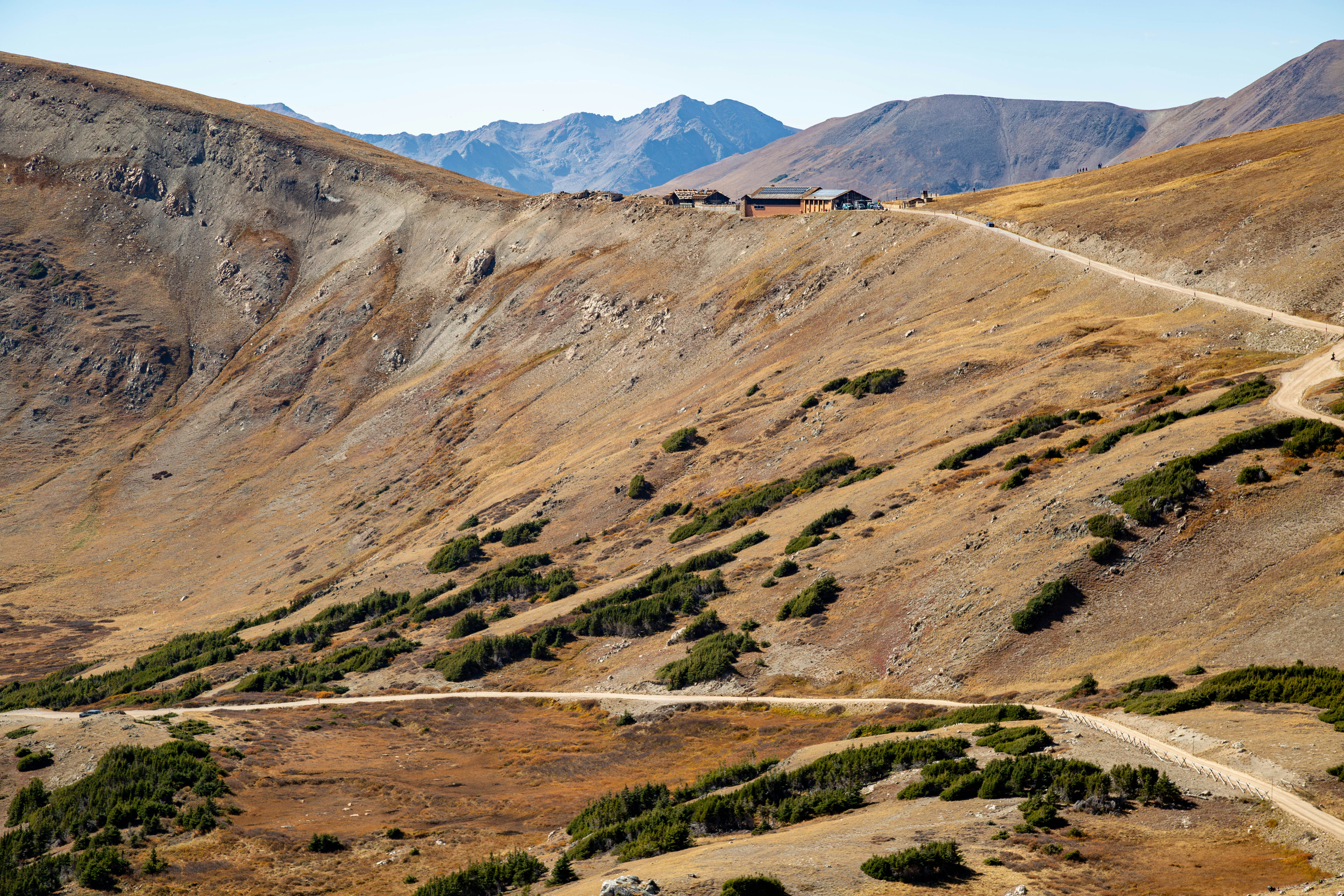 A winding road in the middle of a mountain range