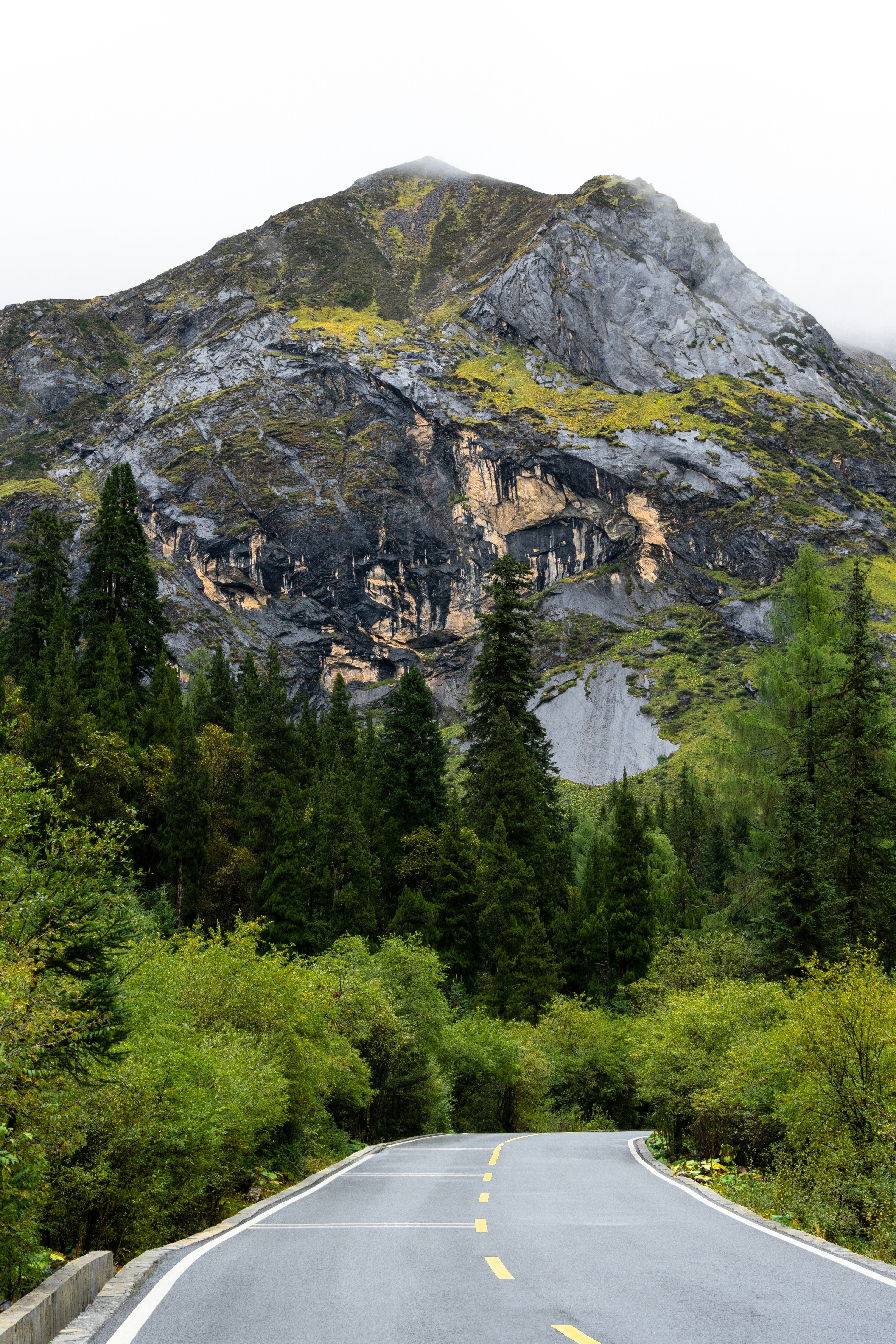A road with a mountain in the background photo – Free Siguniangshan ...