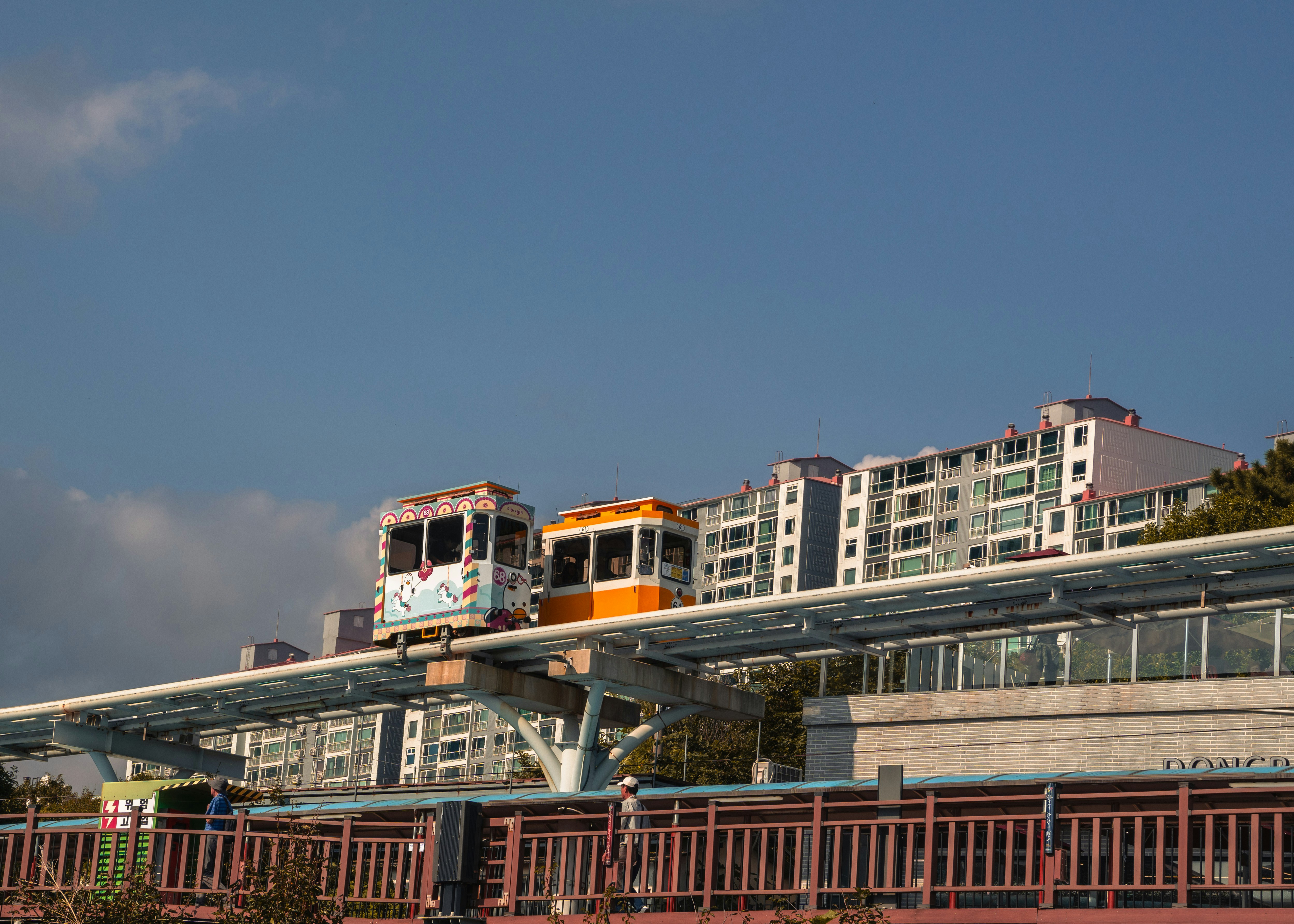 A train traveling over a bridge over a river