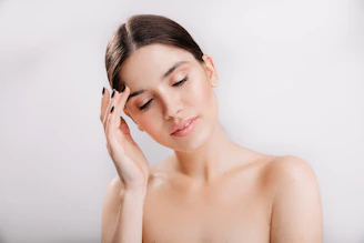 A woman holding her head in her hands