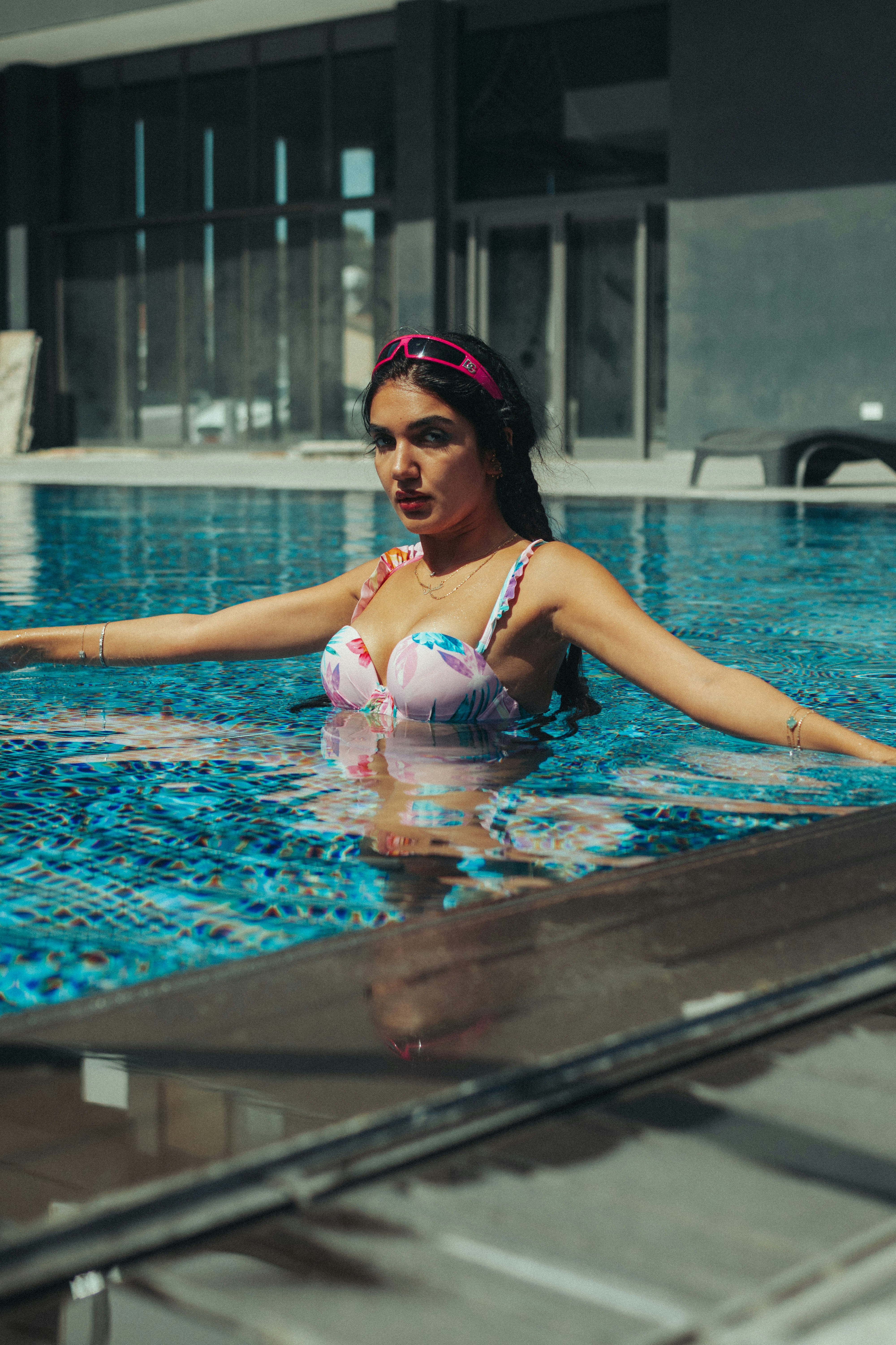 A woman in a bikini in a swimming pool