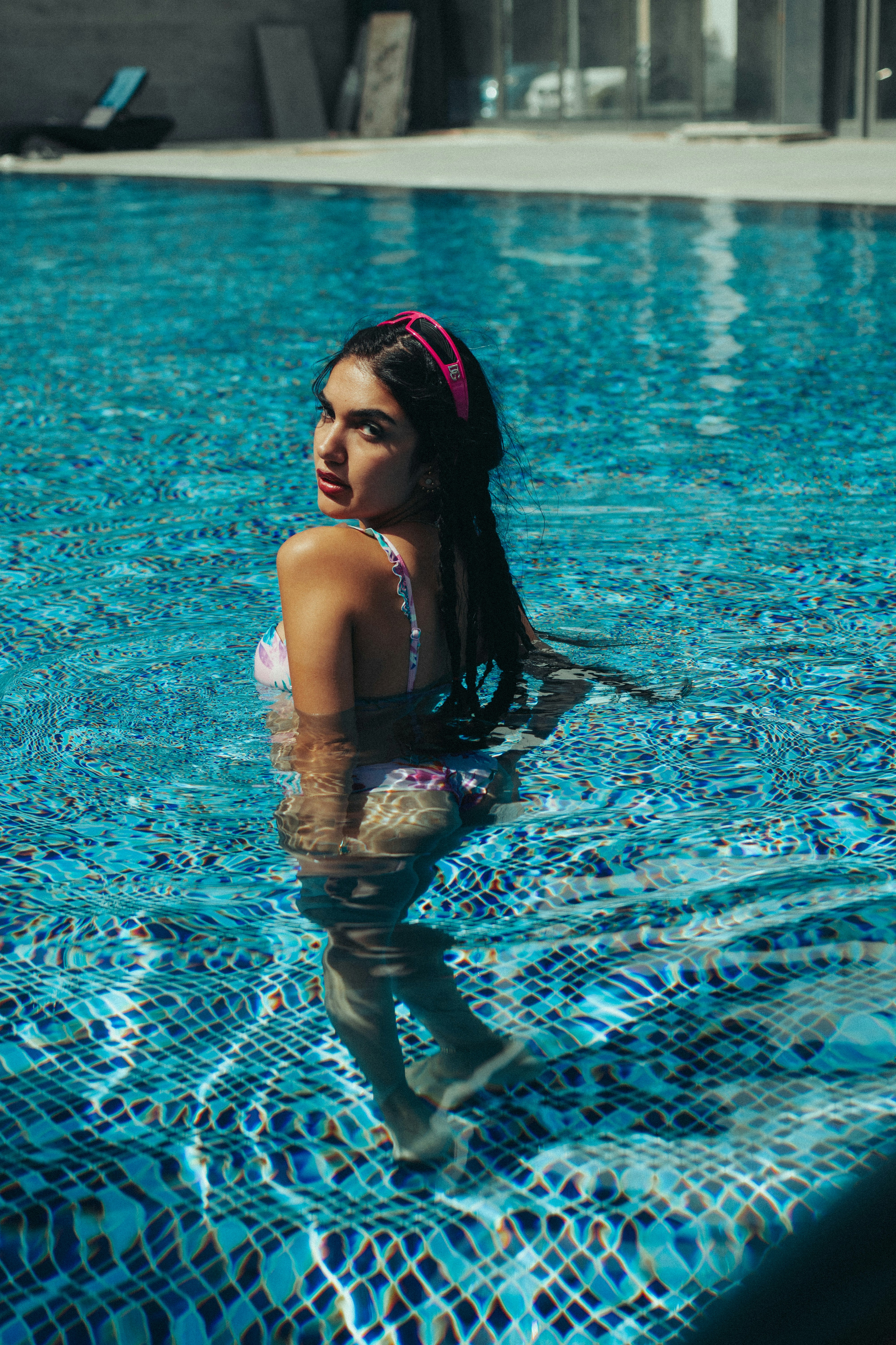 A woman in a bikini in a swimming pool