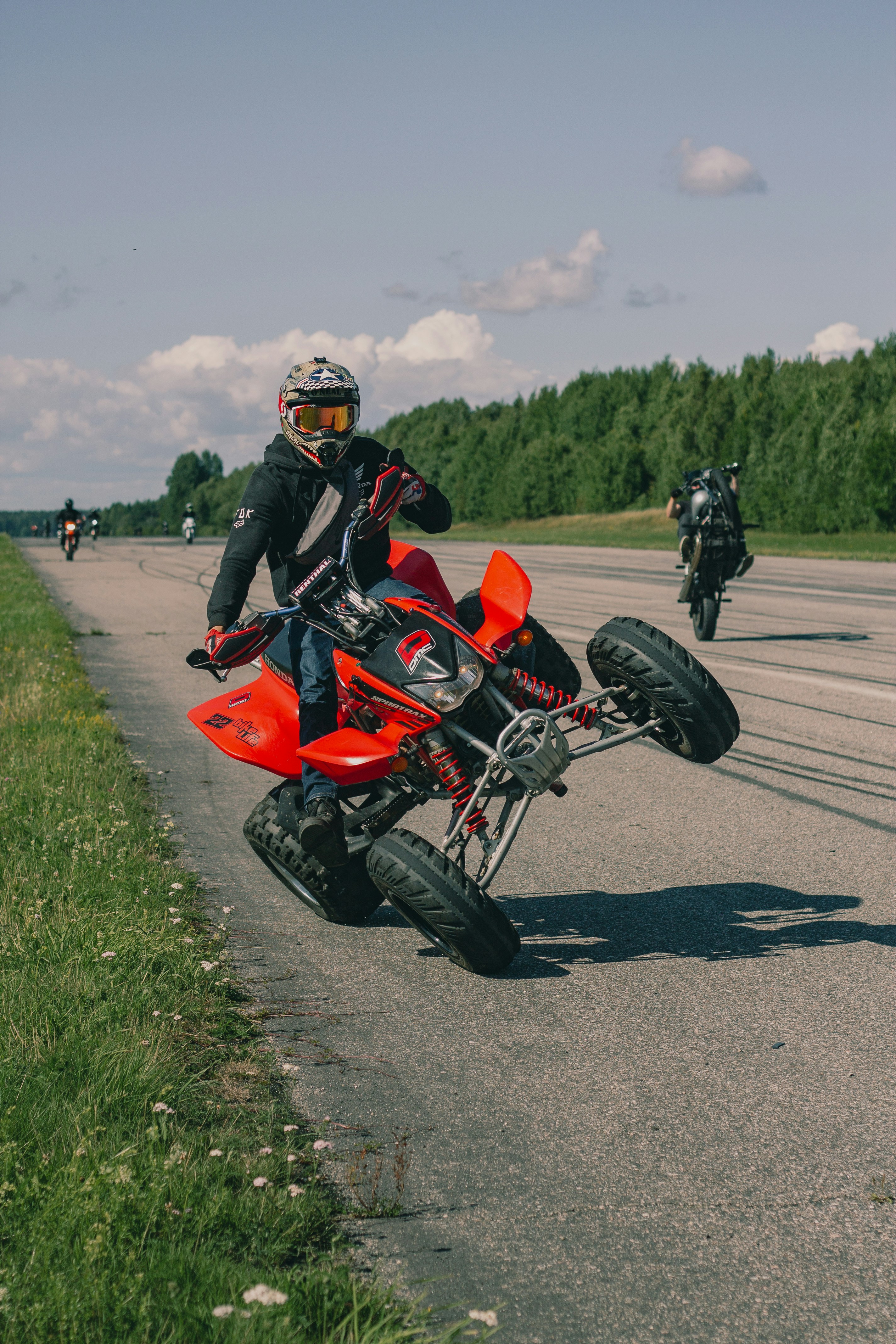 A man riding a motorcycle on top of a road