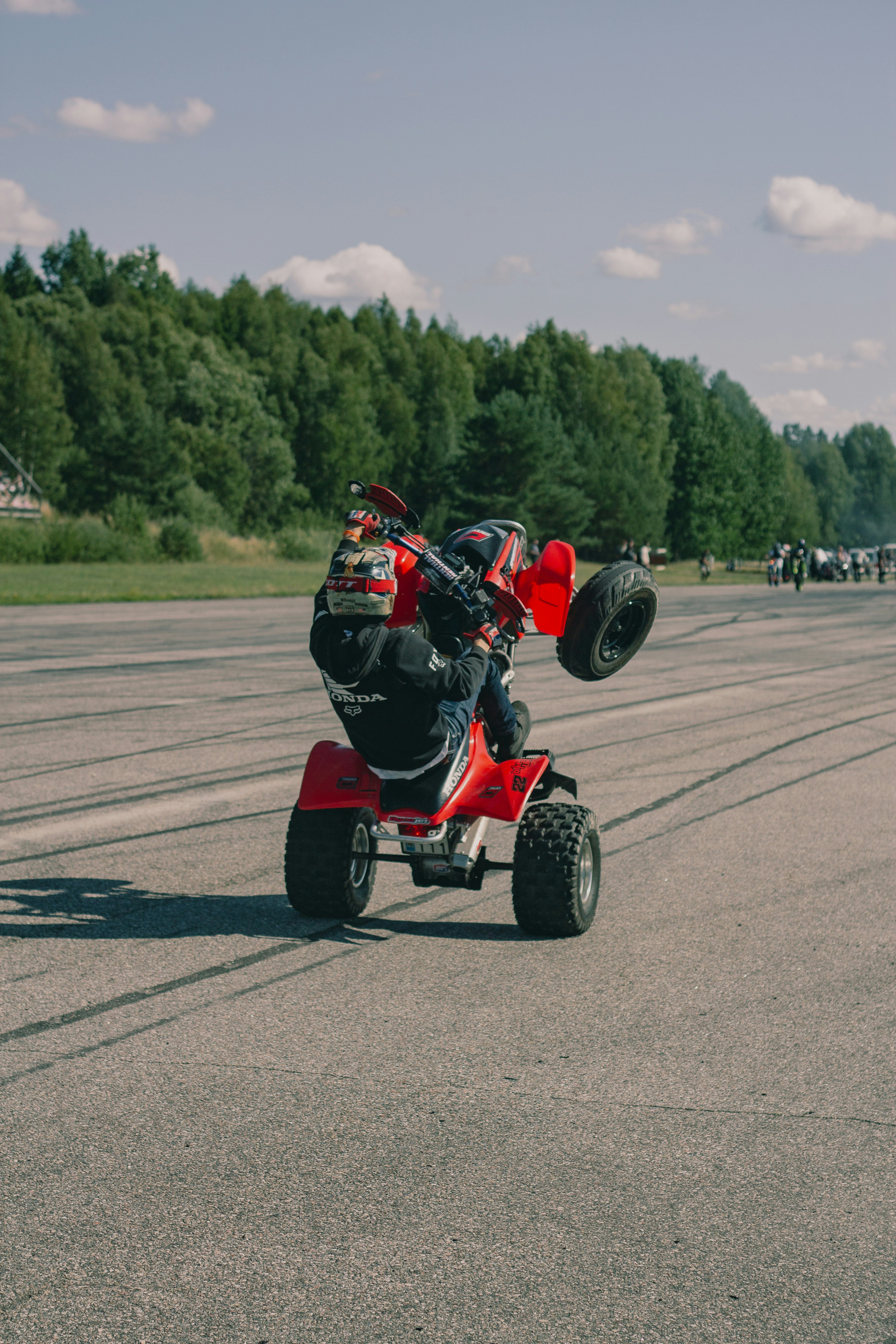 A person riding a four wheeler on a runway