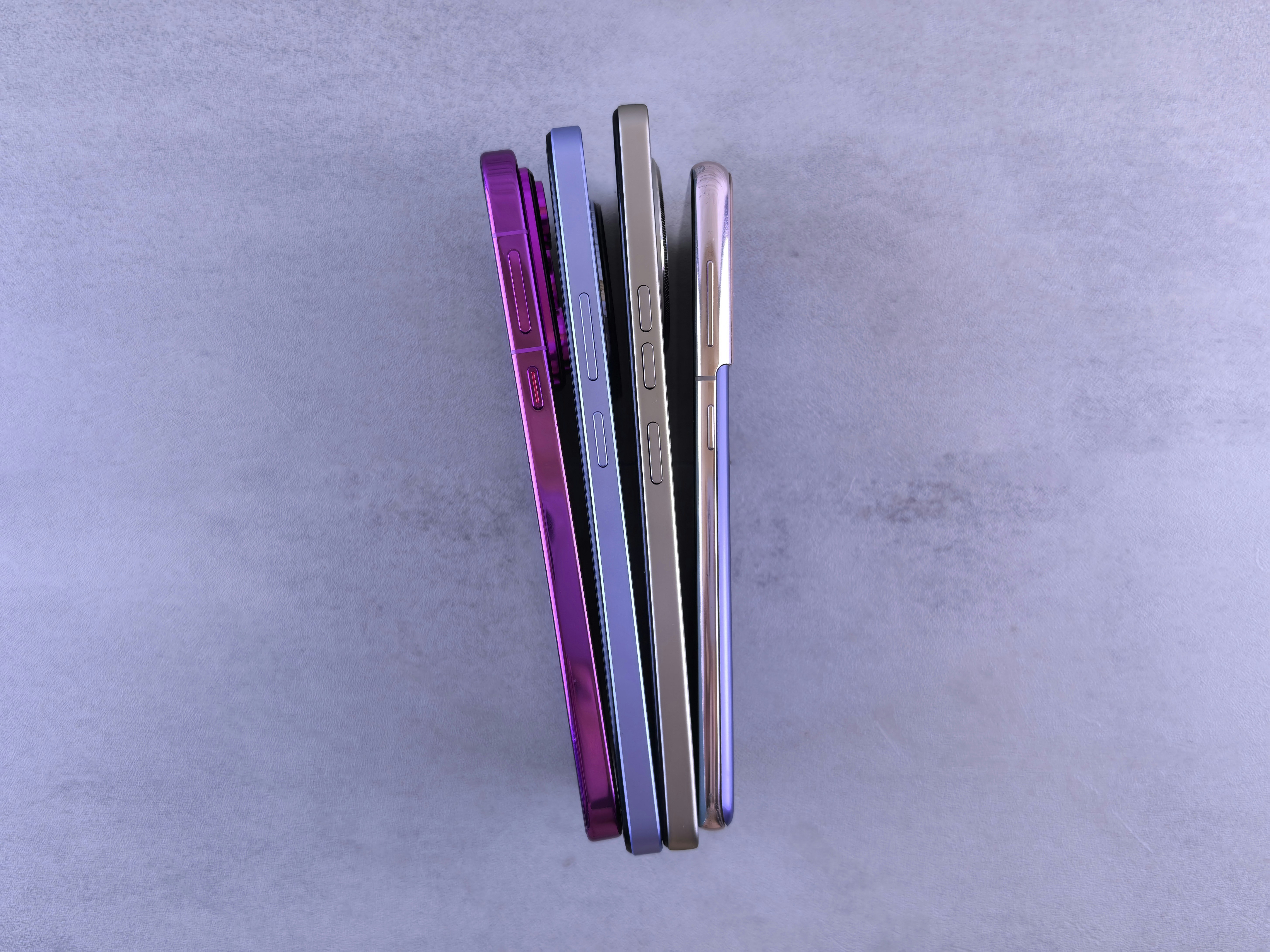 Smartphones arranged on a white surface, bright clean product photography