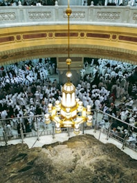 A large group of people standing in a building