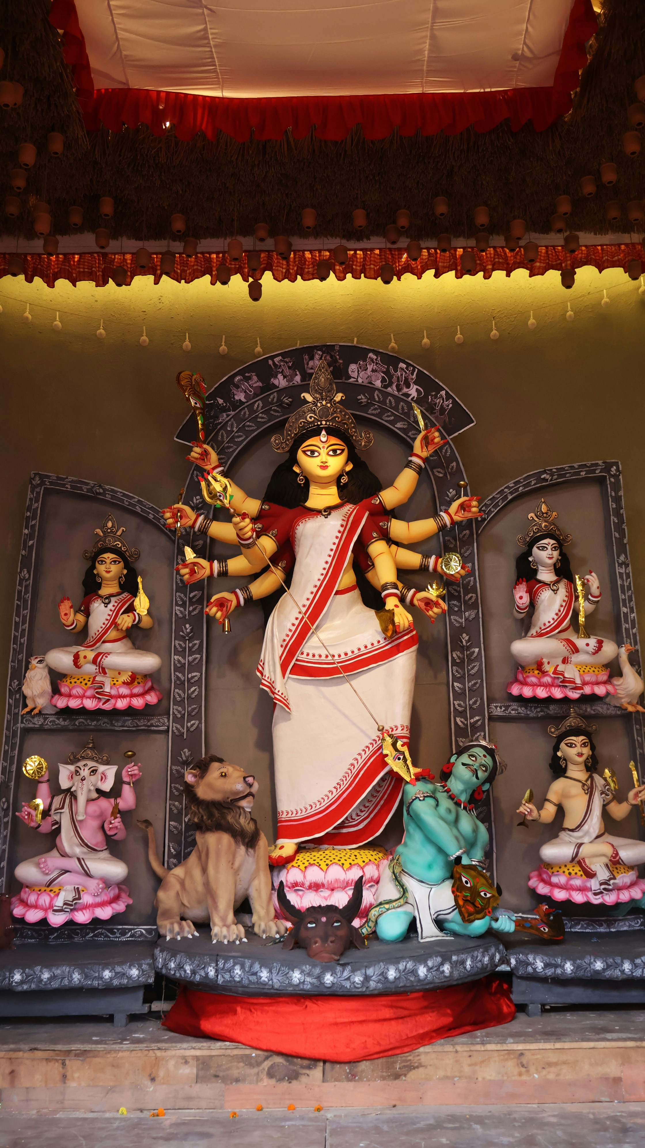 Crystal quartz Goddess Durga idol with eight arms on lion mount, hand-carved