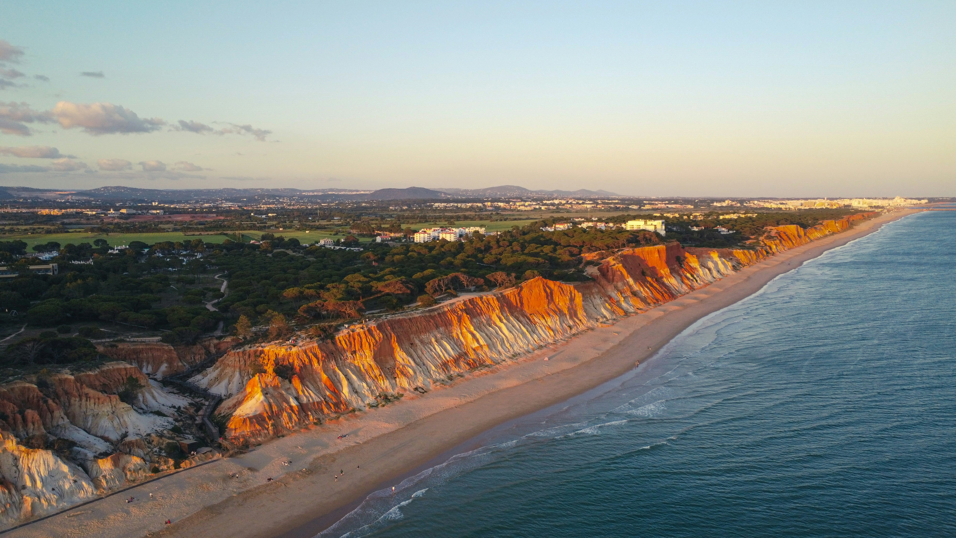 An aerial view of a beach and a cliff
