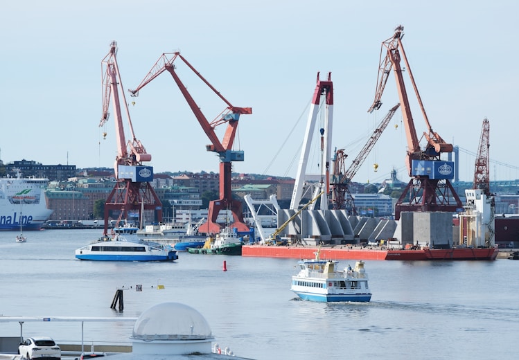A harbor filled with lots of boats and cranes