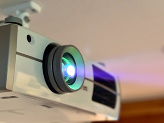 A close up of a projector on a ceiling