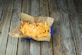 A bag of food sitting on top of a wooden table