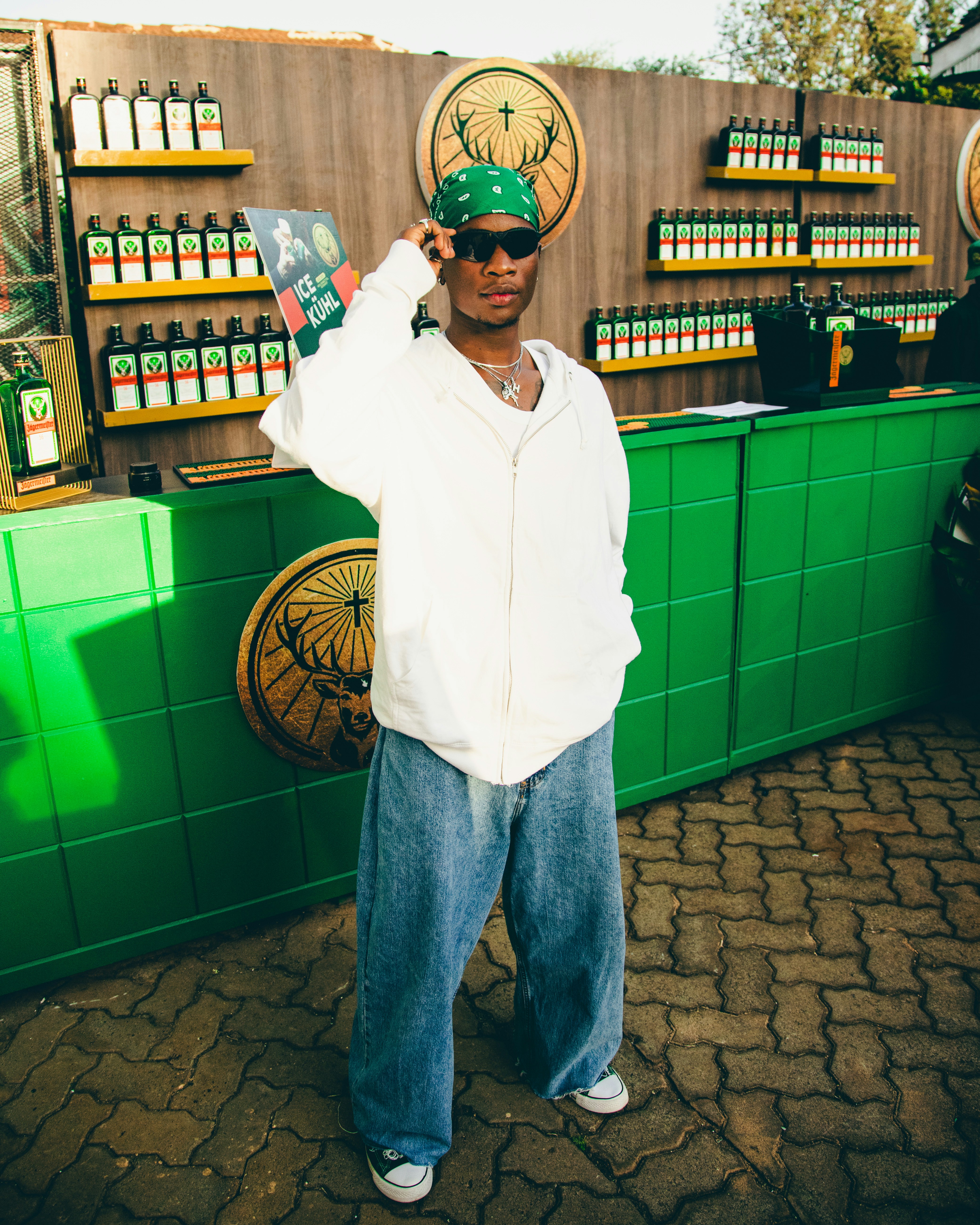 A man is standing in front of a store