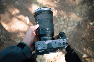 A person holding a camera in their hand