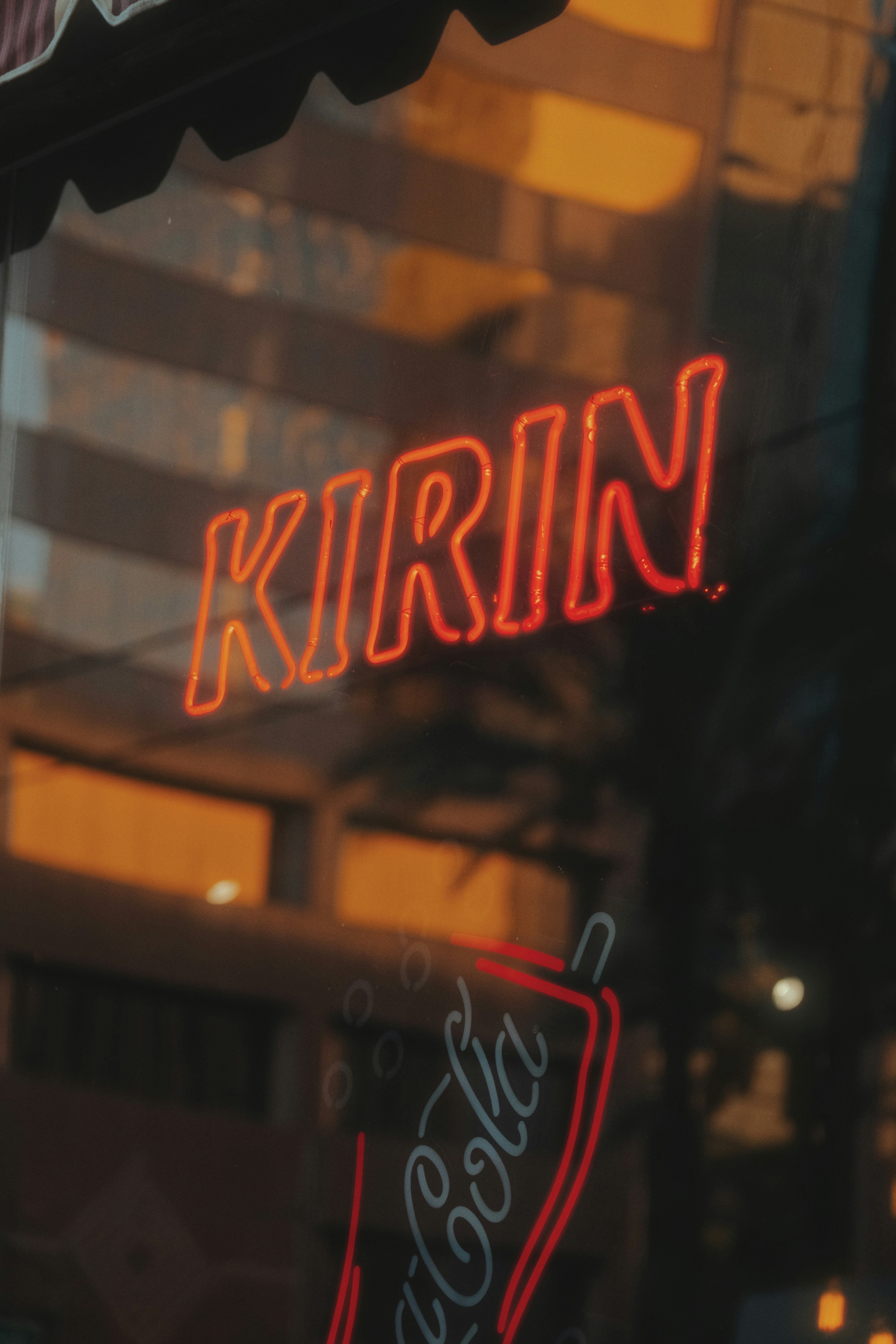 A close up of a neon sign on a building