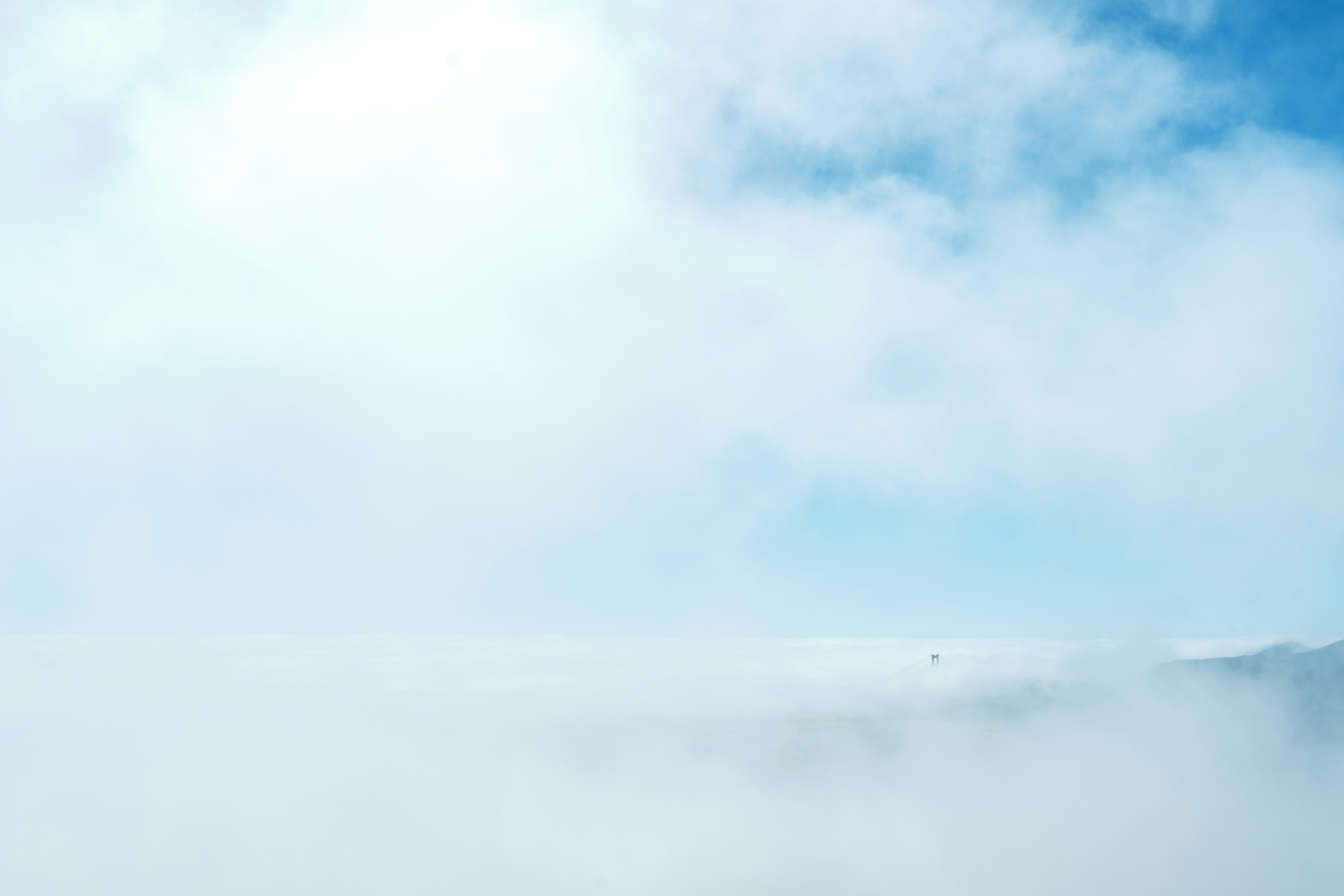 A man riding a snowboard on top of a snow covered slope