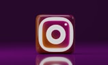 A purple and white instagram icon on a purple background