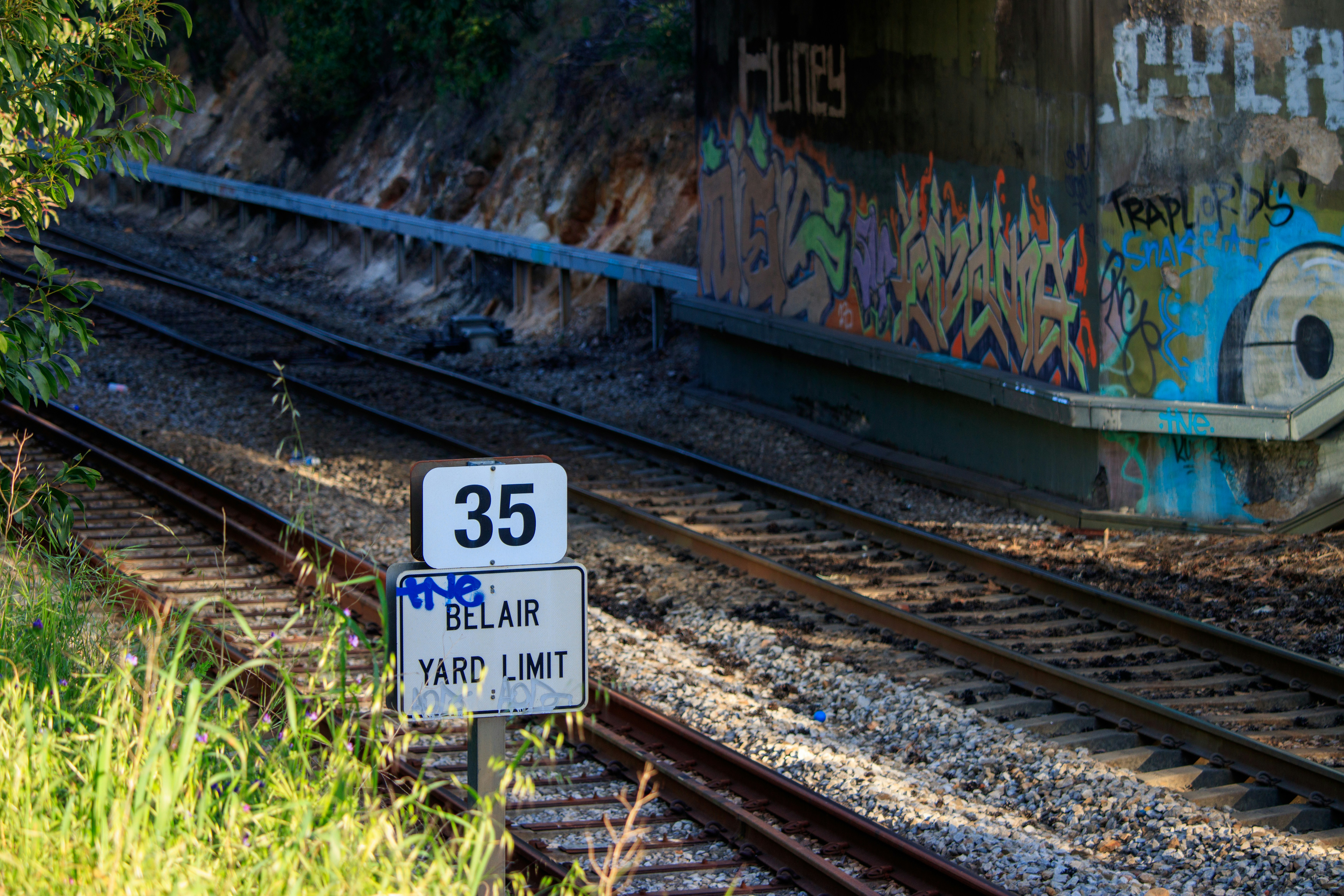A train track with graffiti on the side of it