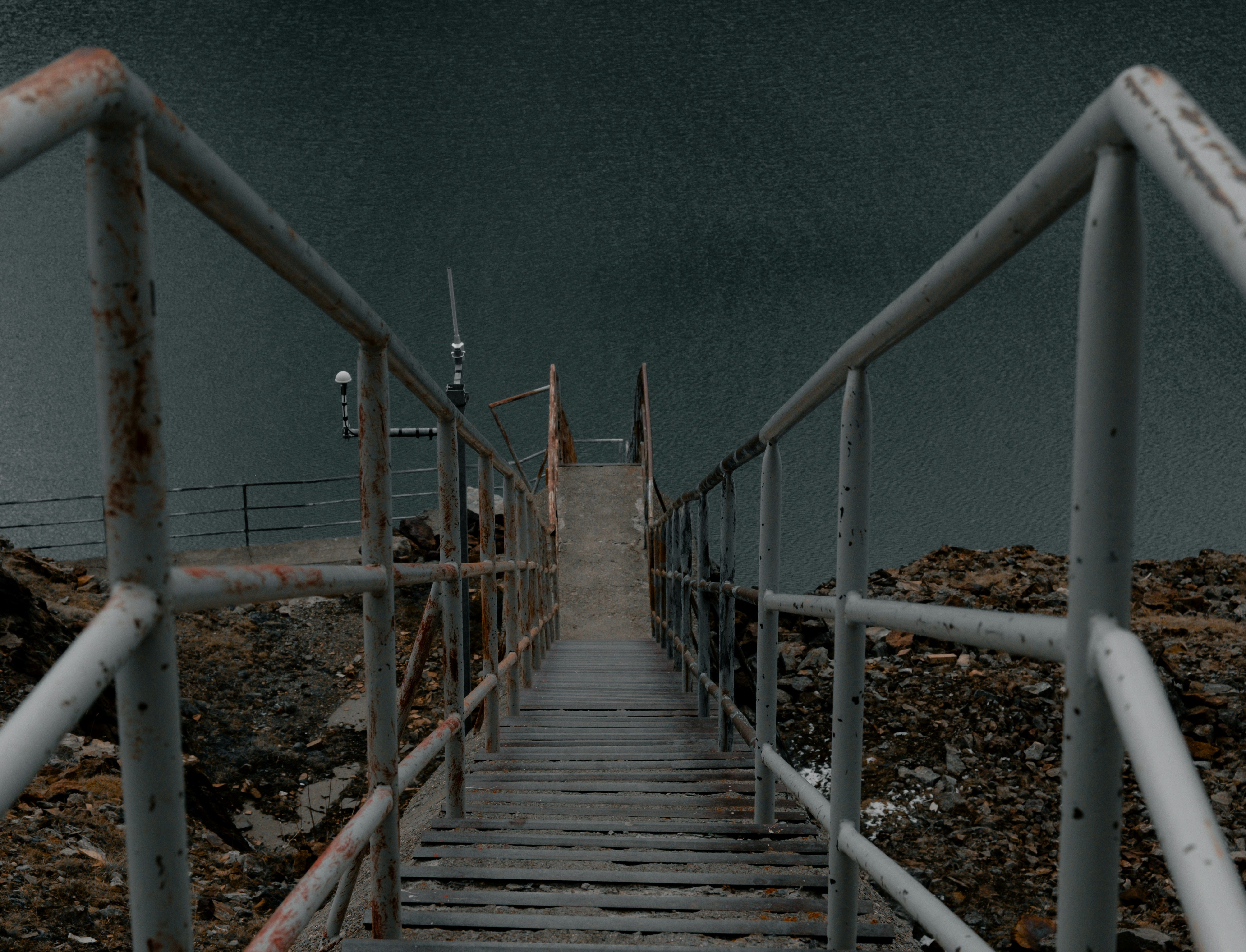 A set of stairs leading to a body of water