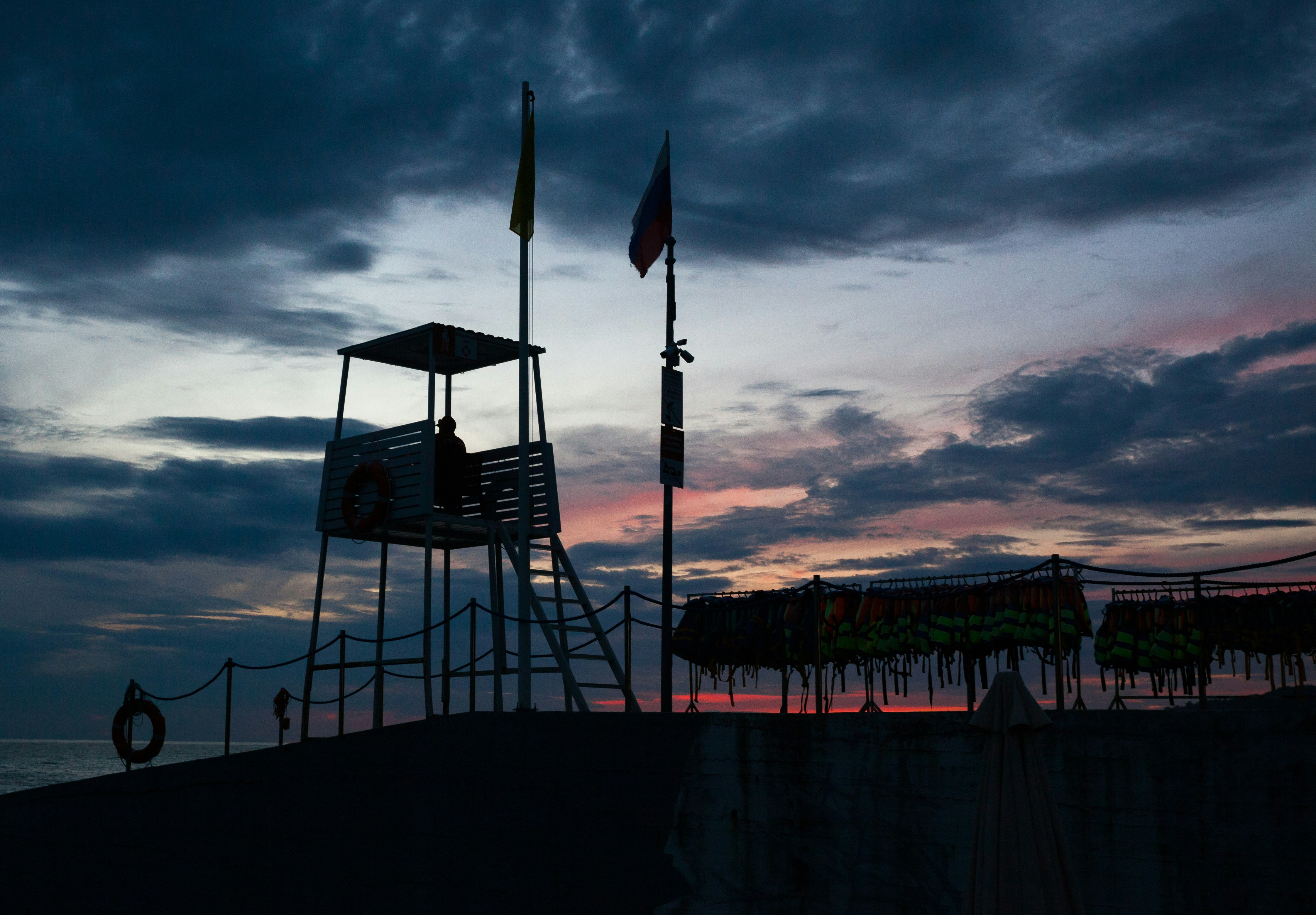 A lifeguard tower sitting on top of a sandy beach