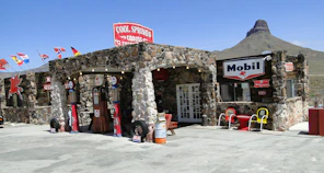 A stone building with a sign on the front of it