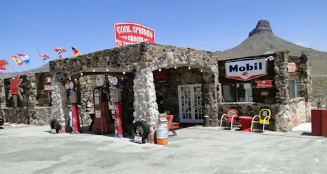 A stone building with a sign on the front of it
