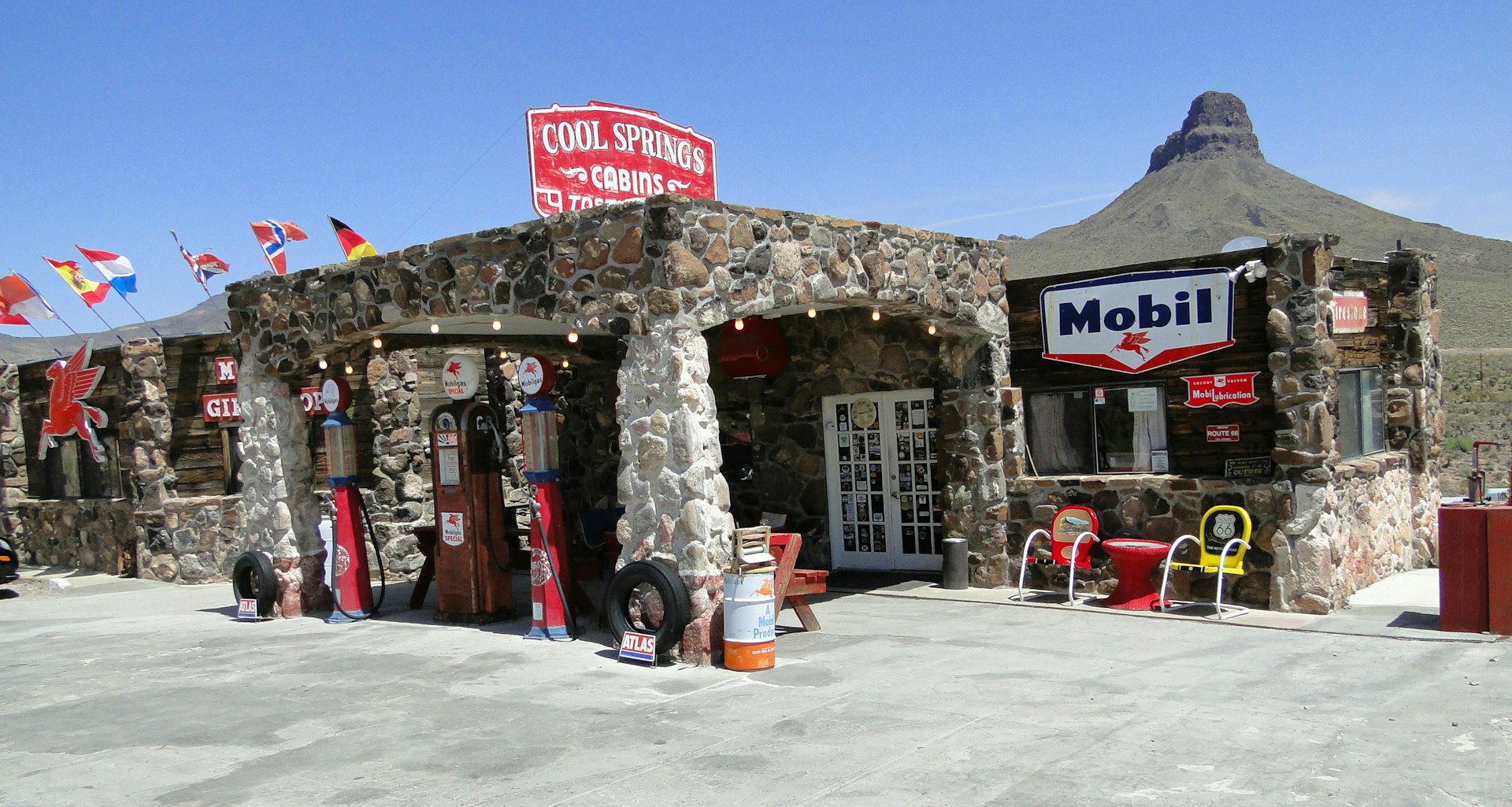 A stone building with a sign on the front of it