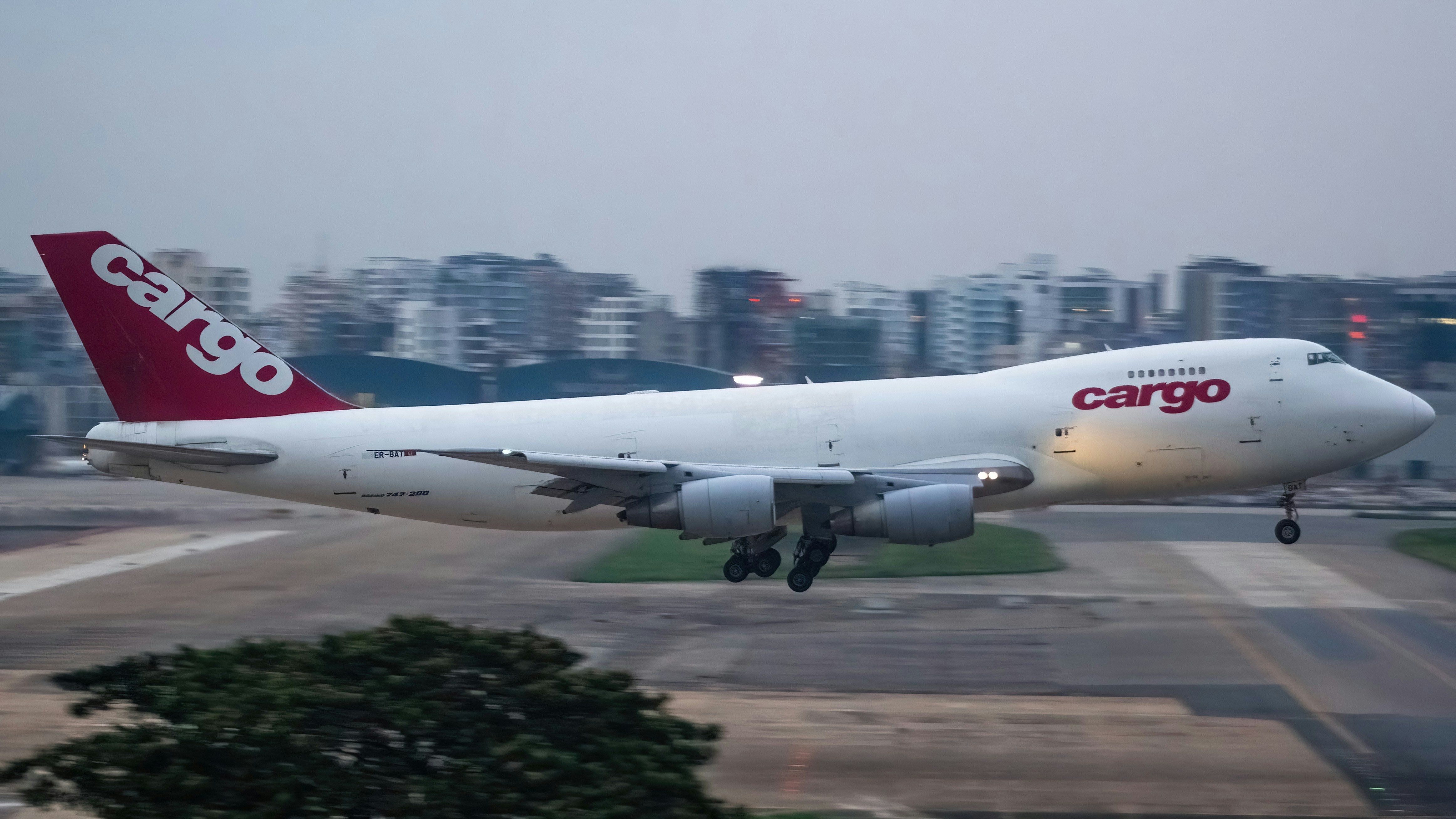 A large jetliner taking off from an airport runway, FlyPro Boeing 747-200F