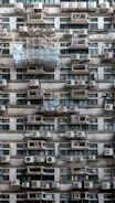 A very tall building with lots of windows and balconies