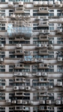 A very tall building with lots of windows and balconies