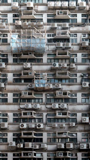 A very tall building with lots of windows and balconies