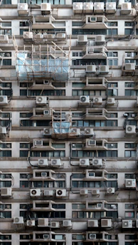 A very tall building with lots of windows and balconies