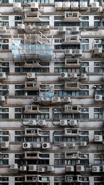 A very tall building with lots of windows and balconies
