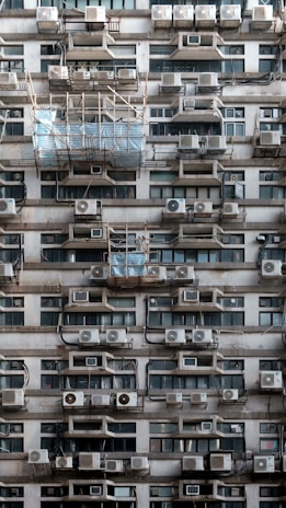 A very tall building with lots of windows and balconies
