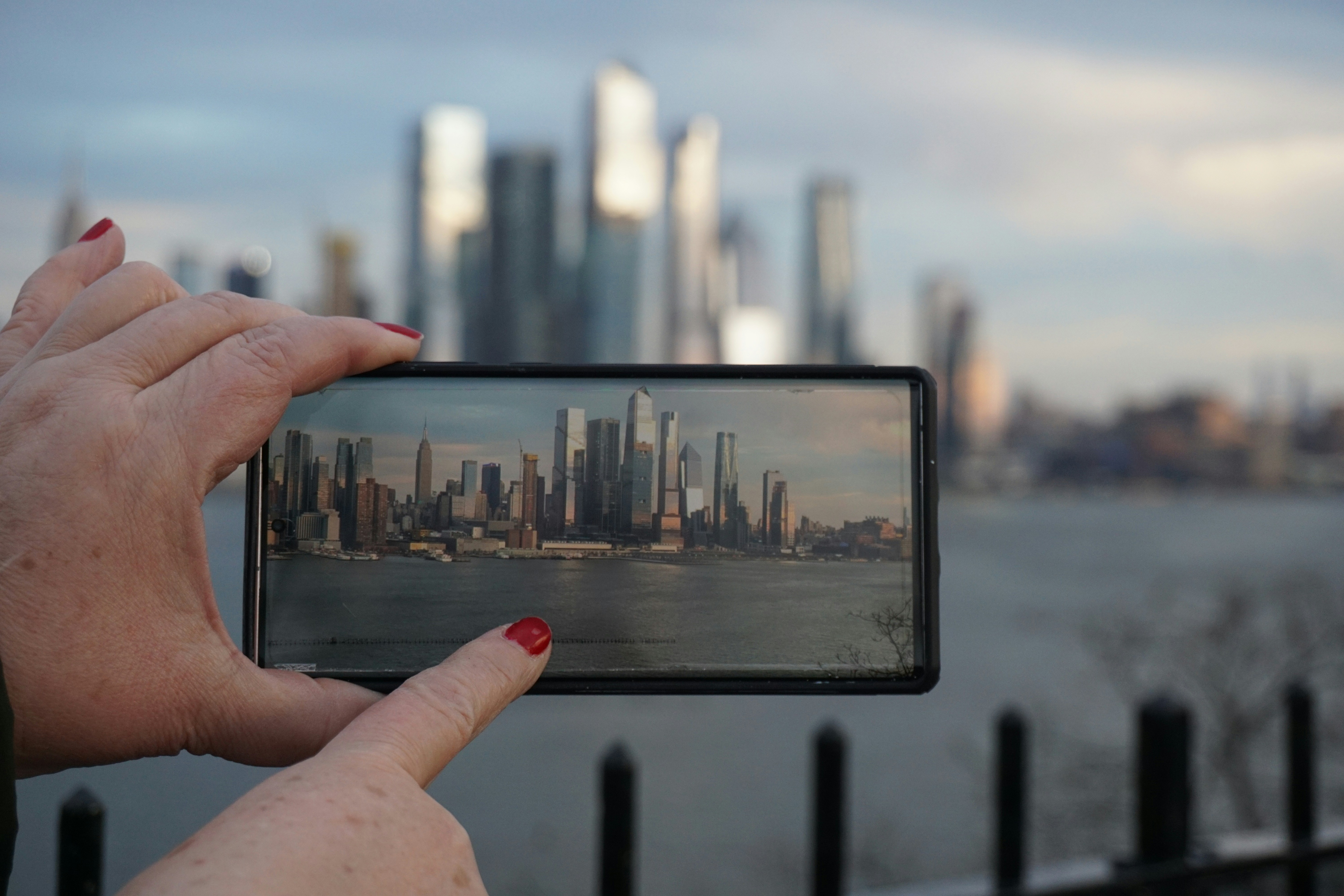 A person taking a picture with a cell phone, 