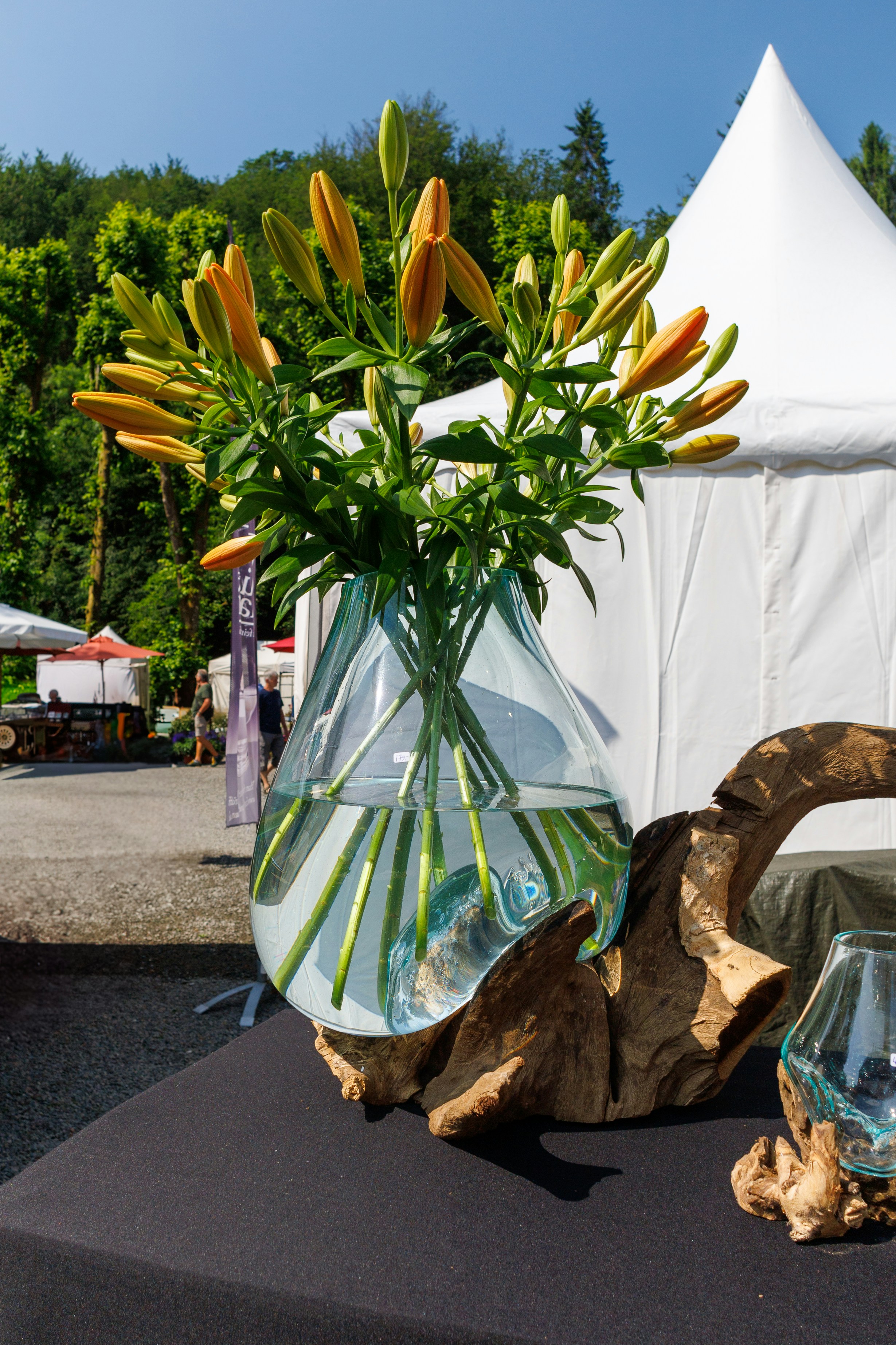 A table topped with a vase filled with flowers