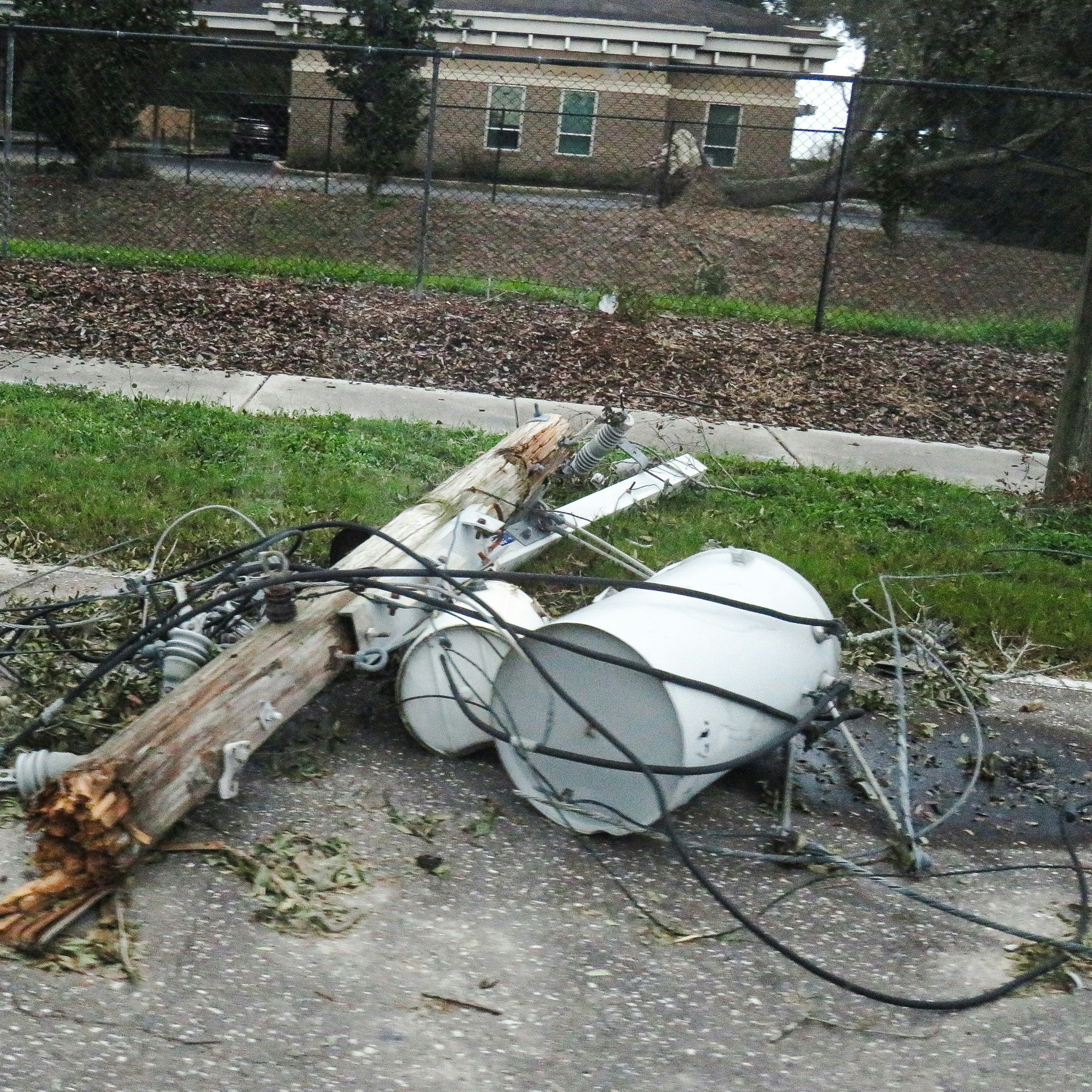 A pile of electrical equipment sitting on the side of a road