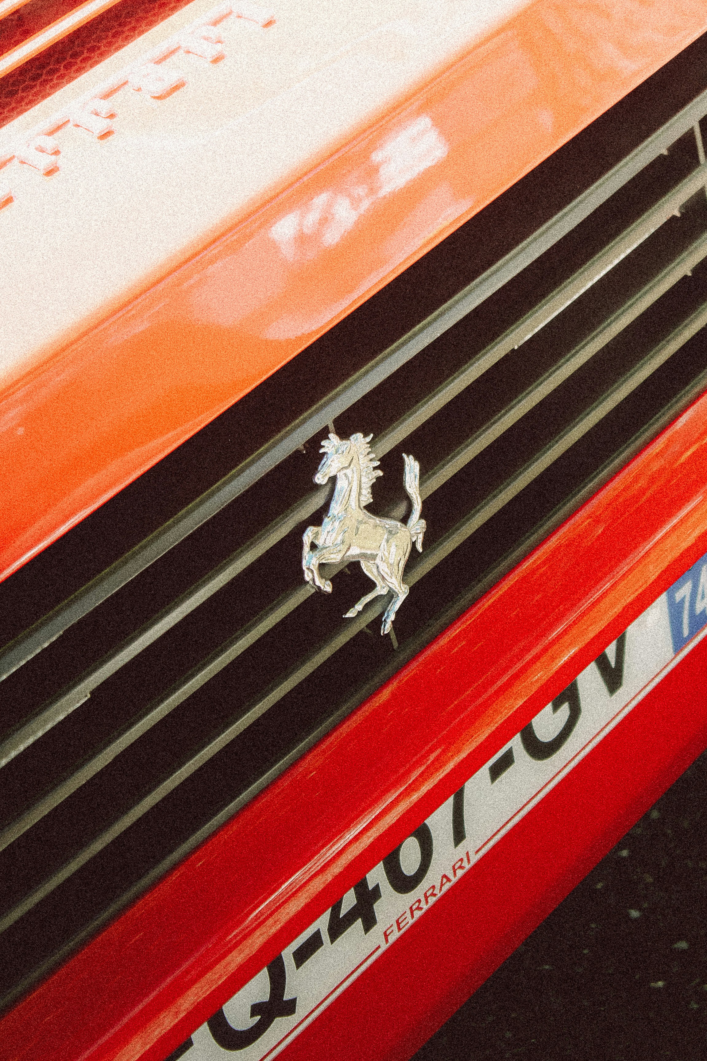 A close up of the front grill of a red car