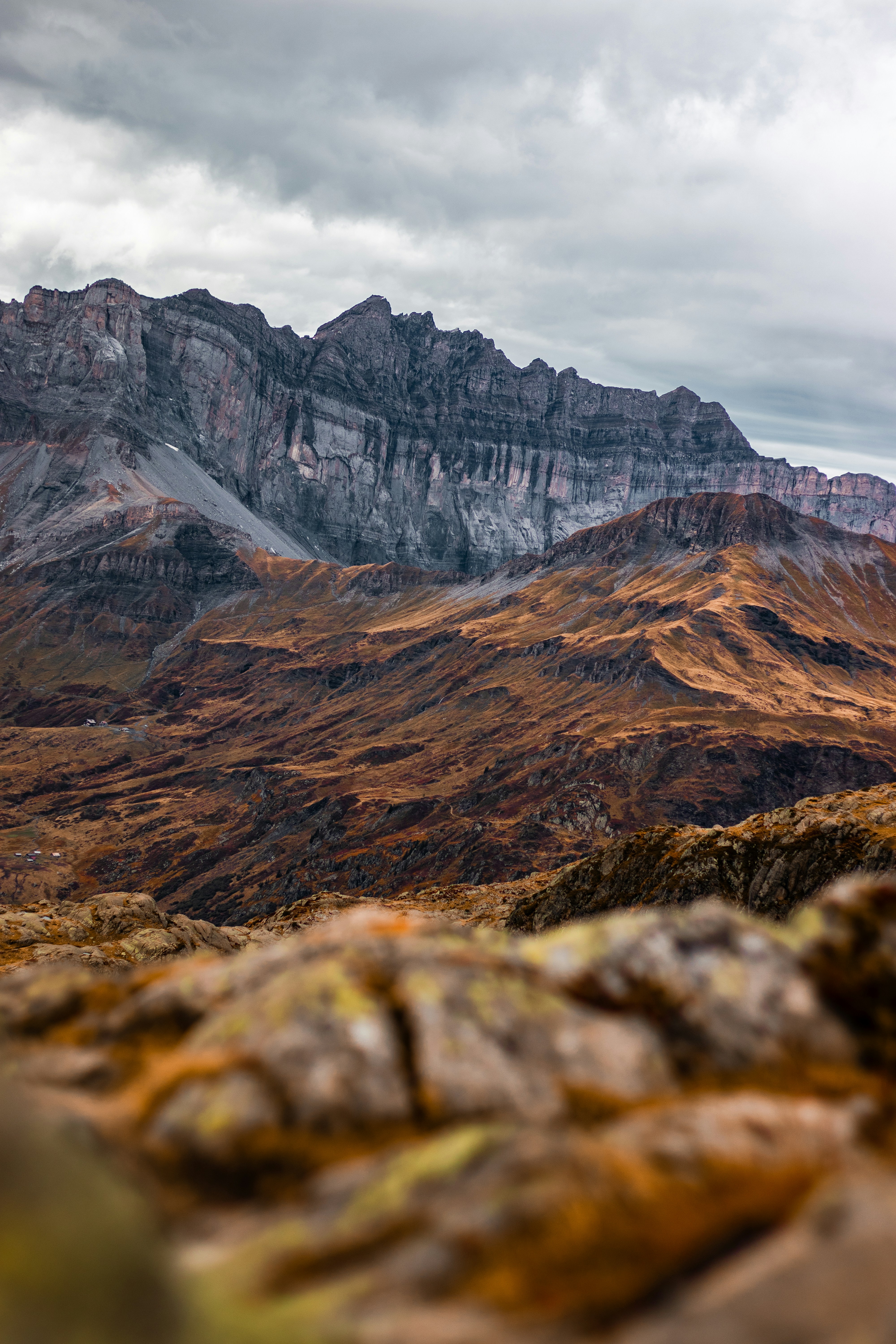 A view of a mountain range from a rocky outcropping