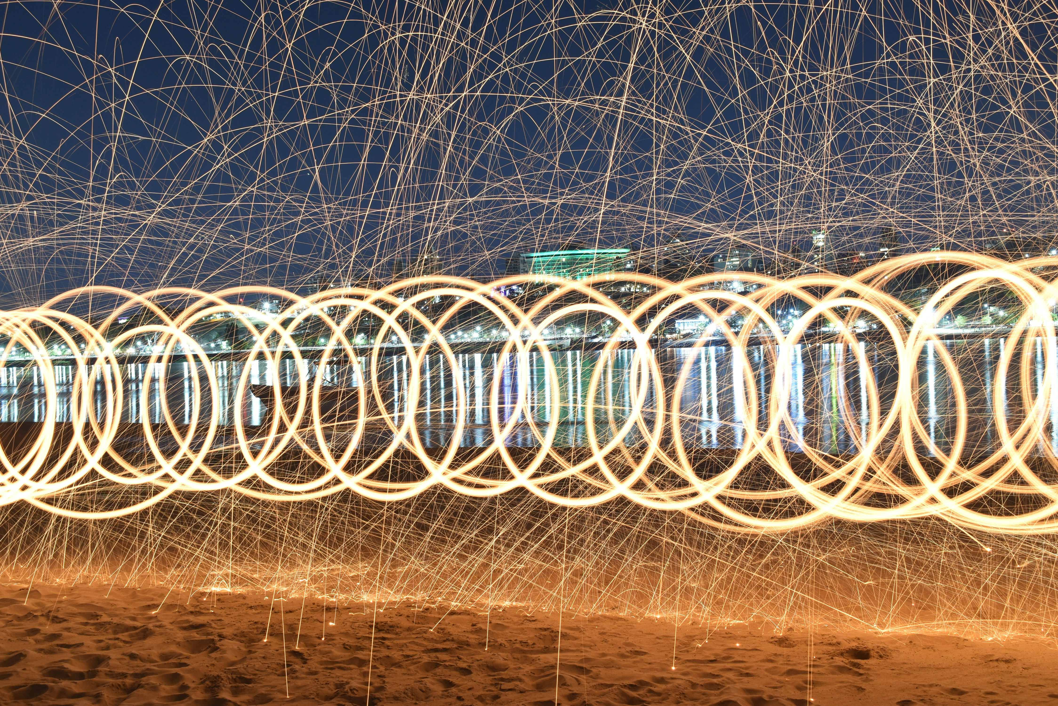 A long exposure photo of a building with lots of wires