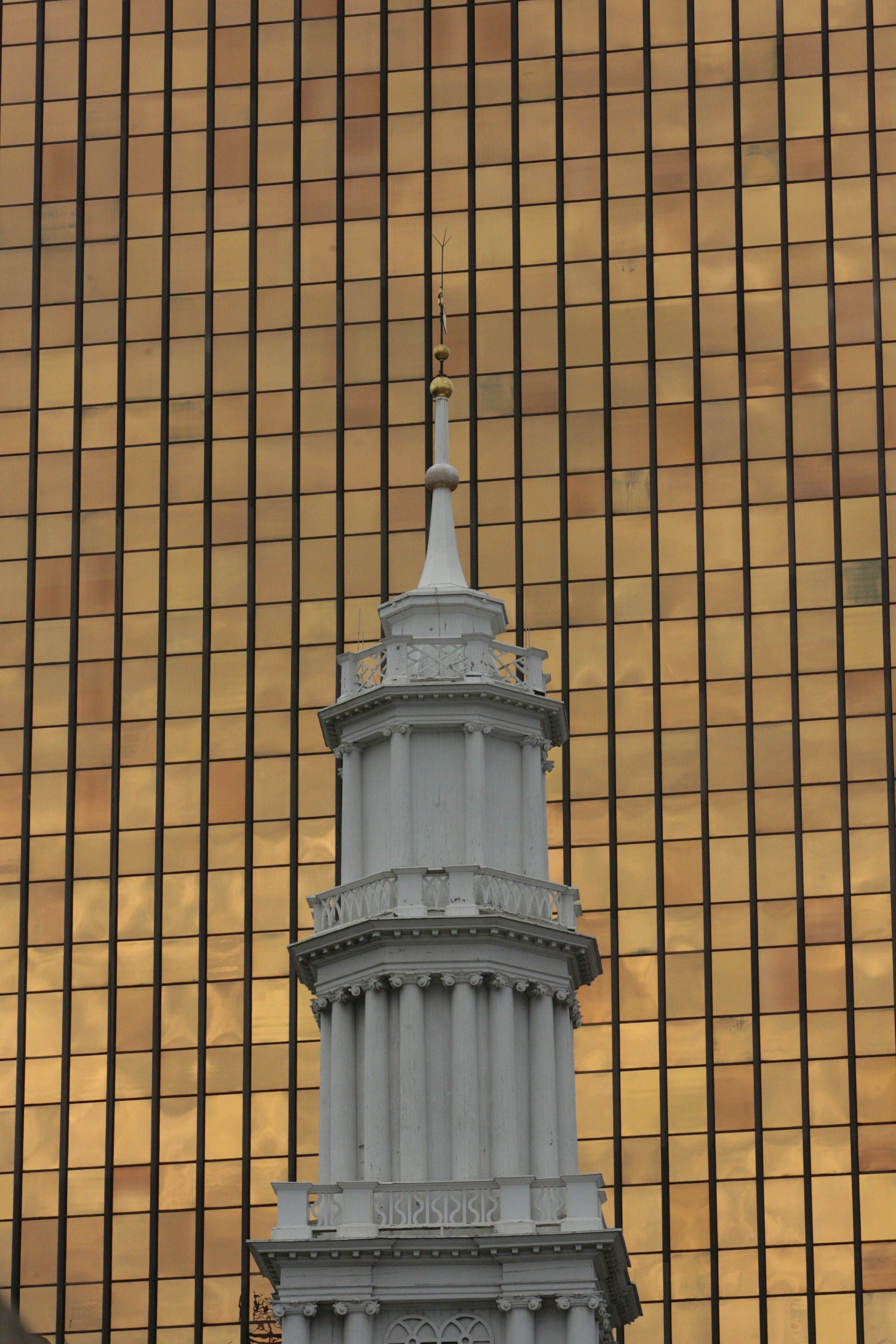 A tall building with a clock on it's side