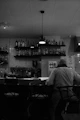 A man sitting at a bar in a restaurant