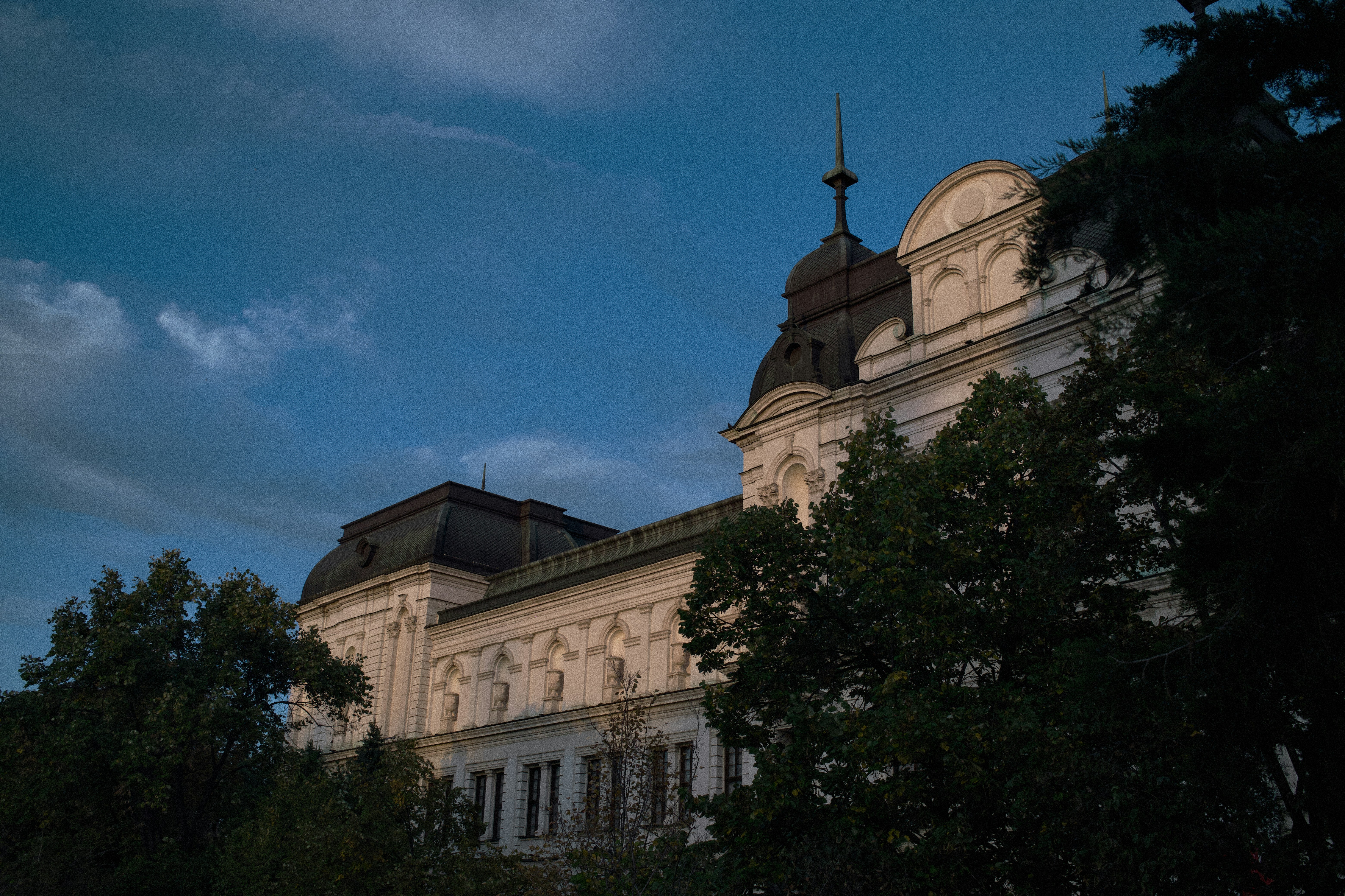 A large building with a clock on the top of it