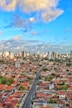 An aerial view of a city with tall buildings