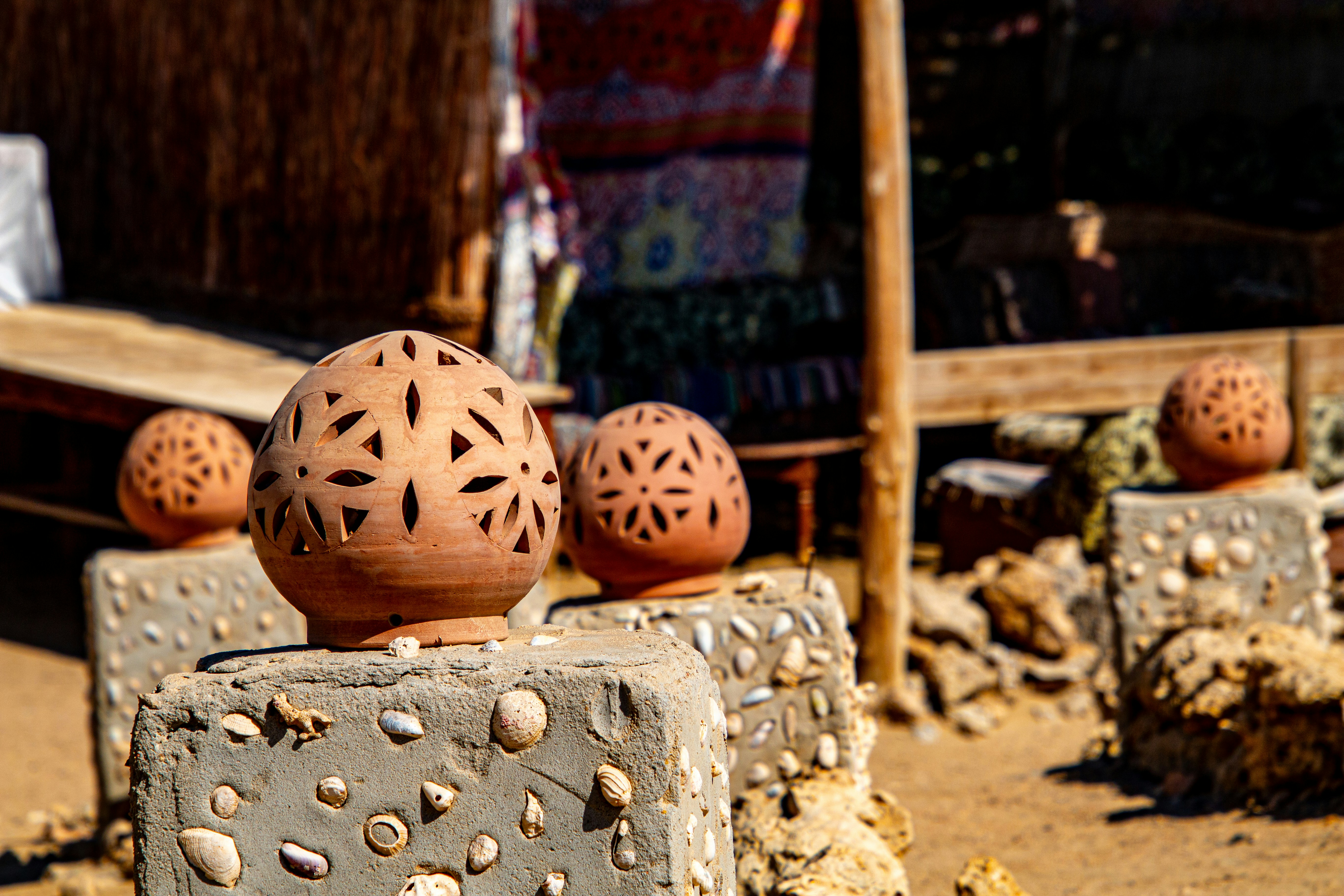A group of clay balls sitting on top of a cement block