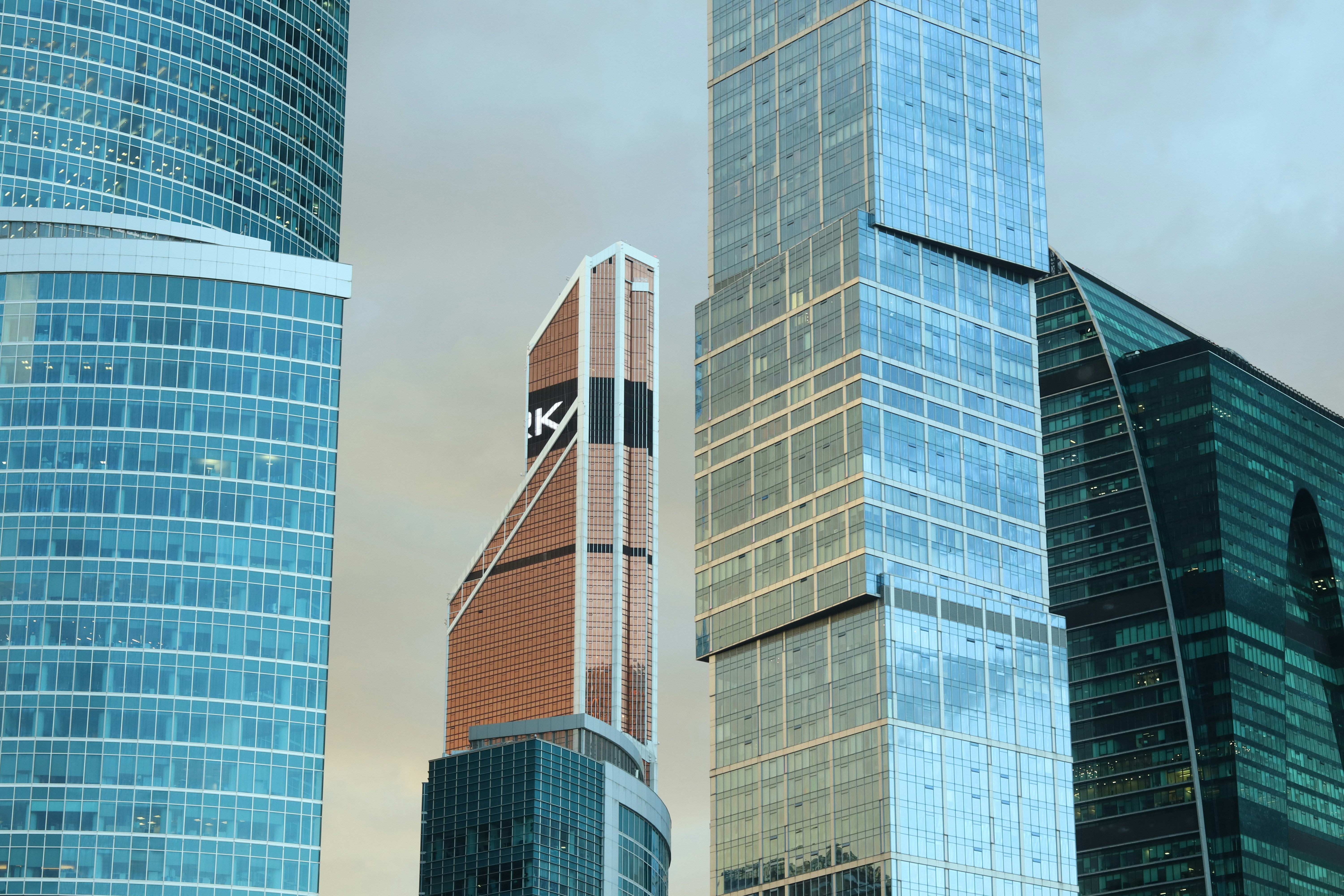 A group of tall buildings sitting next to each other