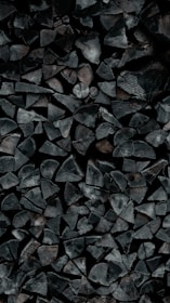 A pile of wood sitting on top of a wooden floor