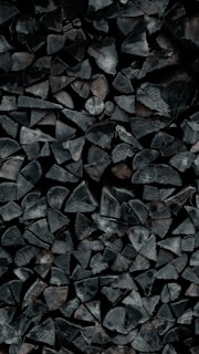 A pile of wood sitting on top of a wooden floor