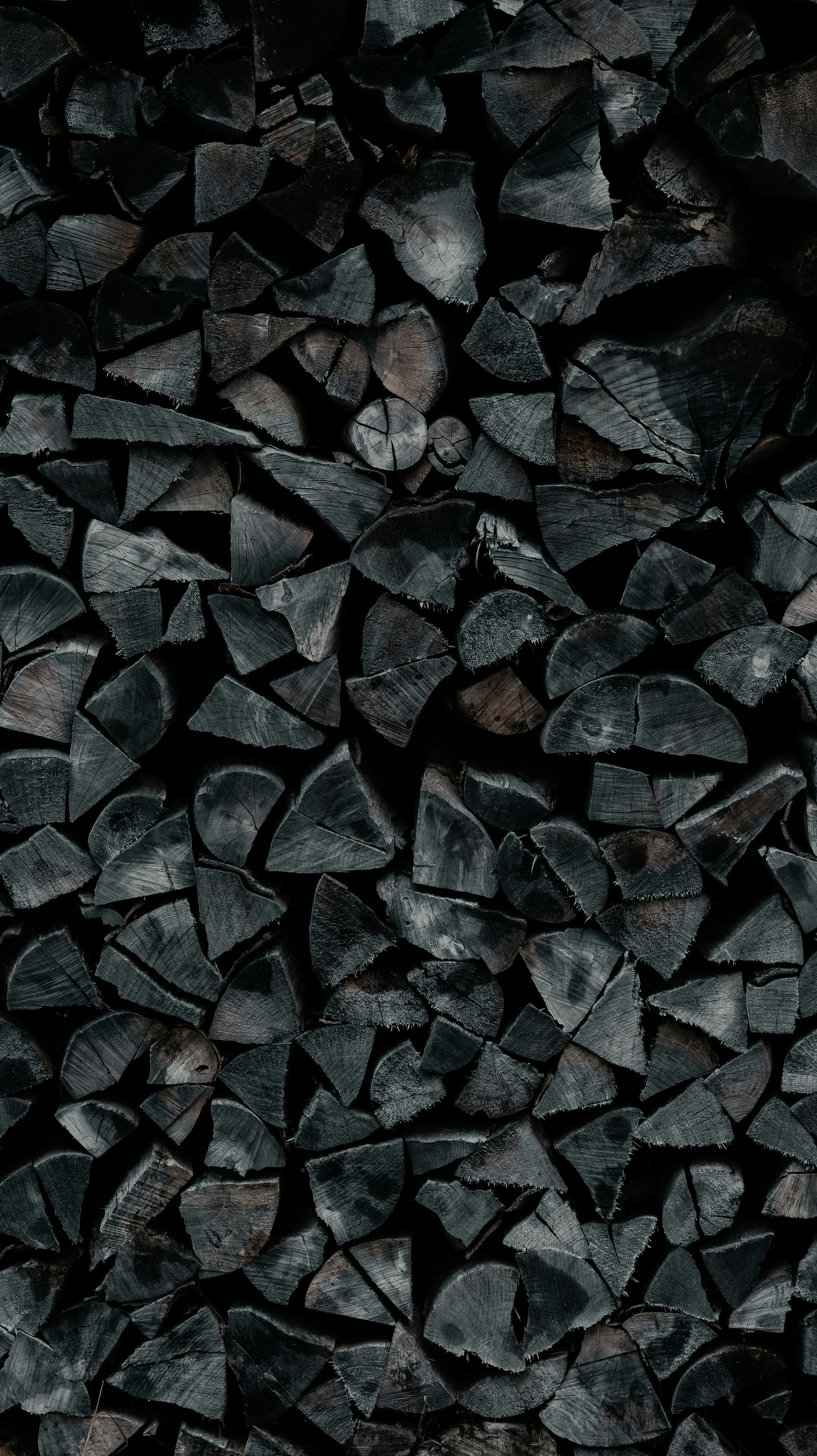 A pile of wood sitting on top of a wooden floor