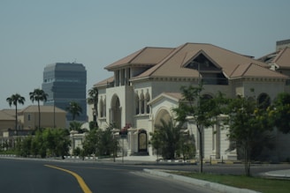A street lined with houses and palm trees