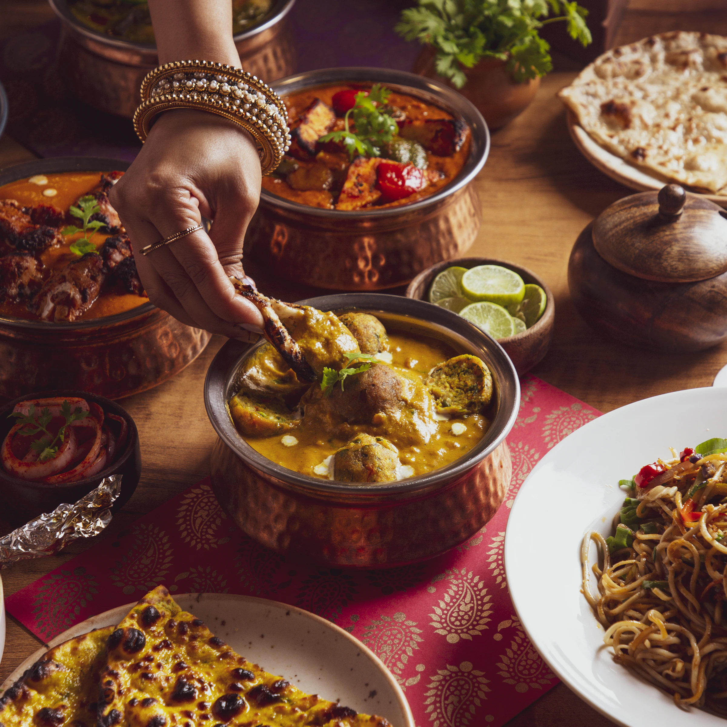 Overhead spread of Hyderabadi dishes styled for a menu shoot